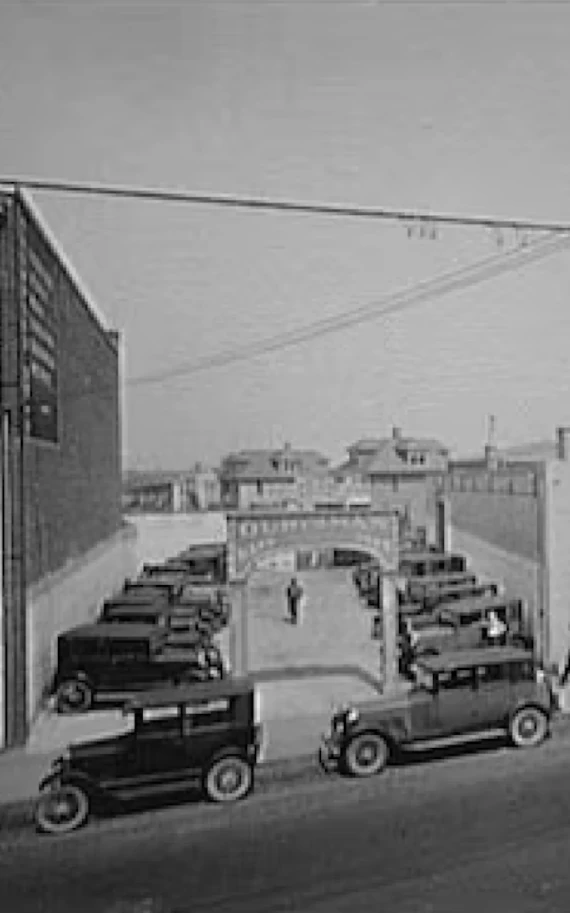 Pre-color photo of the original dealership lot.